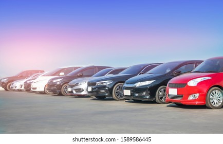 Car in stock for sale inventory. Car park outdoor in a row, automobile transportation dealer business concept