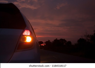 car stop on the road of countryside before night with turn light signal.