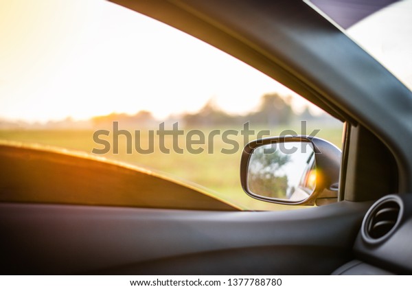 car\
stopped and open door with sunrise in the\
morning