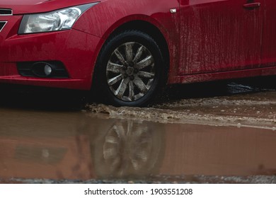 Car Stuck In The Mud, Car Wheel In A Dirty Puddle, Rough Terrain