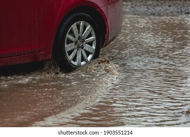 Car Stuck In The Mud, Car Wheel In A Dirty Puddle, Rough Terrain