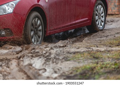 Car Stuck In The Mud, Car Wheel In A Dirty Puddle, Rough Terrain