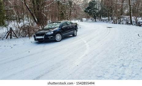 Car Stuck In Snow On A Uphill Road In A Cold Winter In The Lake District. Windermere, Cumbria, UK.