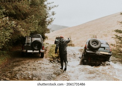 Car Stuck In A Stream Waiting For Rescue