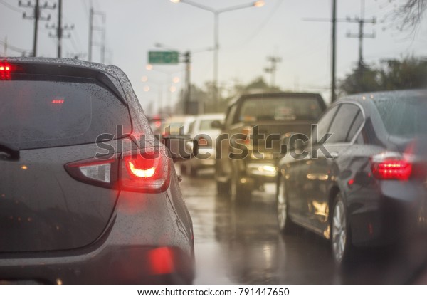 A lot of Car Stuck in Traffic Jam During\
Rainy Day , Orange Light Added ,\
DOF