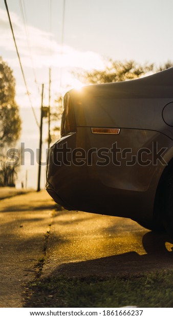 car with sun rays on
an autumn morning