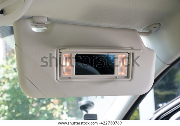 Car sun visor with\
illuminated mirror