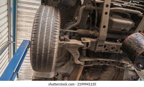 Car Suspension Of Control Arm Tire Wheel.
Rear Suspension Beam.
Drain The Engine Oil Change.
Bottom View.