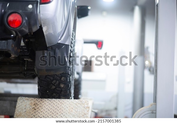 Car suspension repair. Inspection of the\
suspension and replacement of car\
parts.