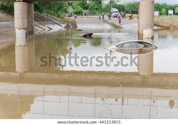 Car swamped by flood water near Buffalo Bayou
Park in Houston, Texas. Flooded car under deep water on a heavy
high water road. Disaster Motor Vehicle Insurance Claim Themed.
Severe weather concept.
