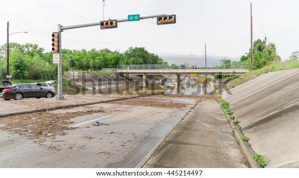Car swamped by flood water near Buffalo Bayou\
Park in Houston, Texas. Flooded car under deep water on a heavy\
high water road. Disaster Motor Vehicle Insurance Claim Themed.\
Severe weather, panorama.