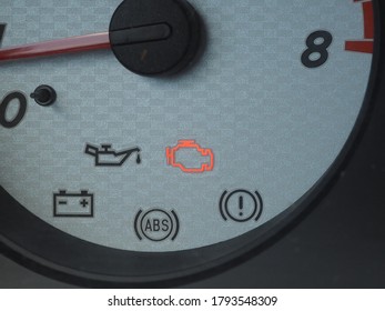 car tachometer panel with active engine diagnostics indicator