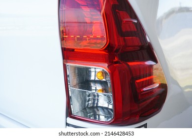 car taillights. The function of a car's taillight is to signal other cars, so they can keep their distance.