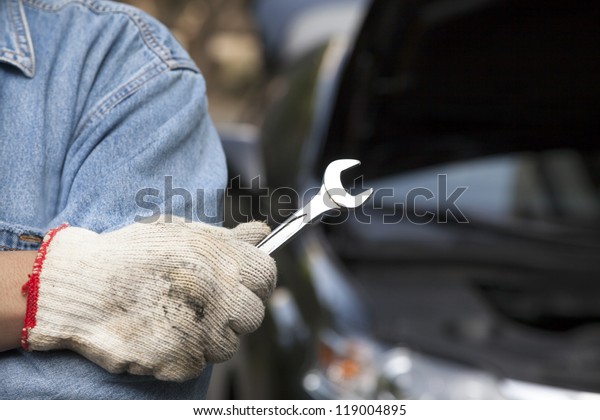 car technician holding the\
wrench