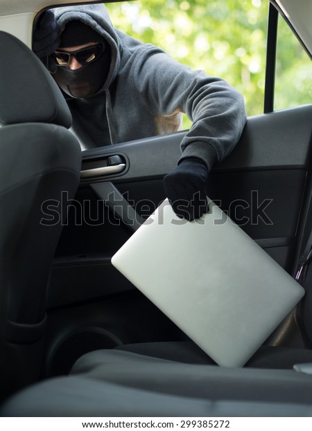 Car theft - a laptop being stolen through the\
window of an unoccupied car. \
