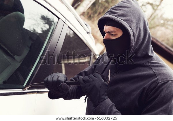 car theft\
- thief trying to break into the\
vehicle