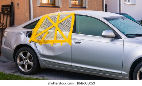 Car Thief Broken Window On A Car In The Rear Passenger Side Of The Vehicle, The Window Is Taped