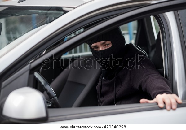 Car\
Thief gets into a stolen car. Car thief, car\
theft