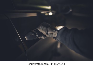 Car Thief Hand on a Door Handle. Grand Theft Auto Concept. Automotive Theme.