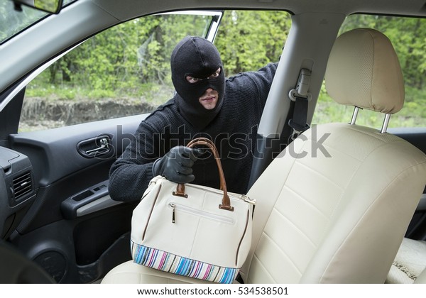 Car thief inside the\
car.