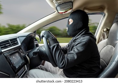 Car thief man runaway with a stolen car on the street