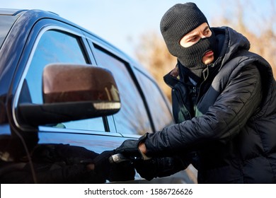 Car Thief In Car Theft Is At The Car Door