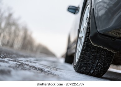 Car Tire Close Up On The Winter Snowy Road Close Up Background.