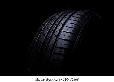 Car Tire Isolated On Black Background 