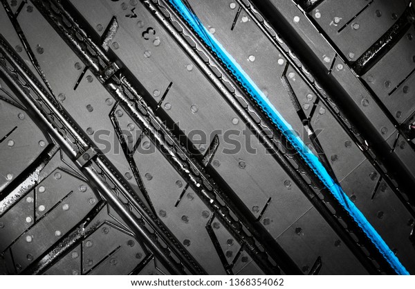 Car tire isolated on\
black background. Tire stack. Car tyre protector close up. Black\
rubber tire. Brand new car tires. Close up black tyre profile. Car\
tires in a row
