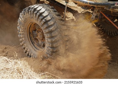 car tire Mud Terrain Red Pickup off road  4WD 4x4 spin mud dirty track on mountain hill.                                           - Shutterstock ID 2155921633