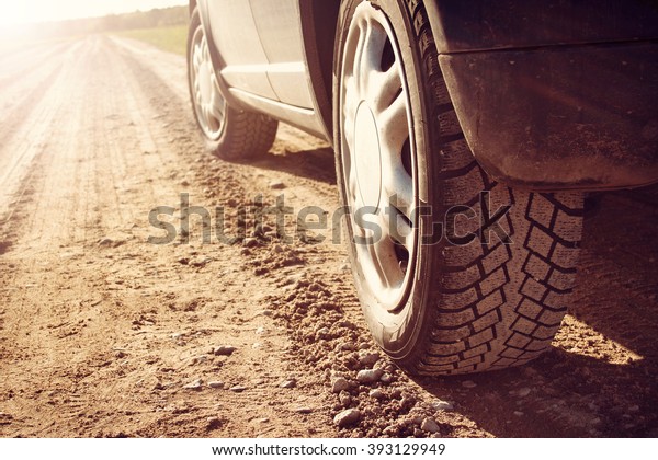 car tire on dirt\
road