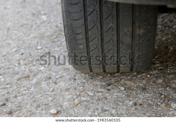 Car tire on road, close\
up