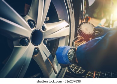 Car Tire Pressure Check in the Auto Service Garage. - Shutterstock ID 516237838