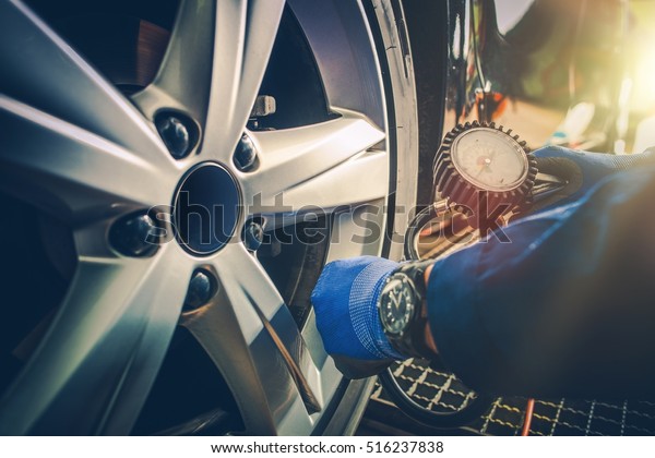 Car Tire
Pressure Check in the Auto Service
Garage.
