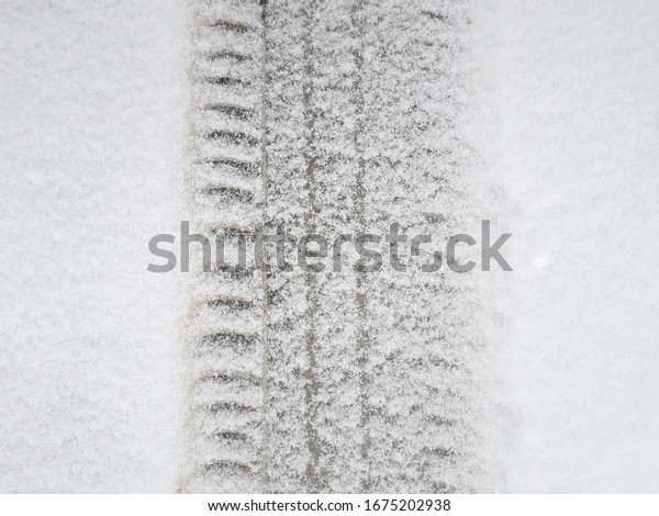 Car tire print on the \
snow