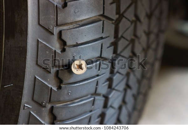 Car tire\
puncture due to running over a\
bolt