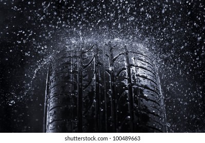 Car Tire In Rain.