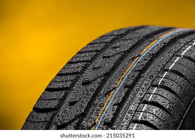 Car tire with raindrops summer tire aquaplaning