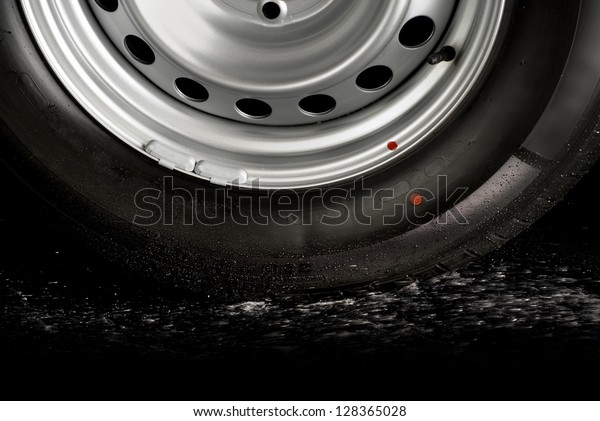 Car tire\
splashing in water, Tire with\
water.