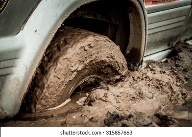 Car Tire Stuck In The Mud