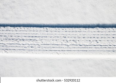 Car Tire Track In Snow