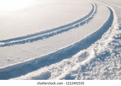 Car Tire Tracks In Fresh Snow