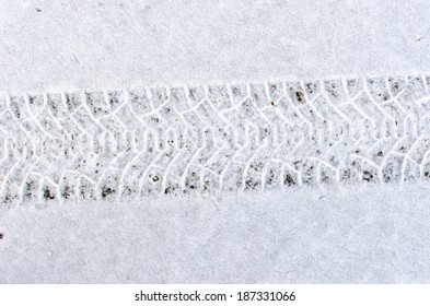 Car Tire Tracks In Fresh Snow