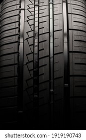 car tire, tread close-up. driving safety and aquaplaning. auto background, vertical photo