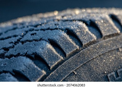 Car tire in winter on an icy road	