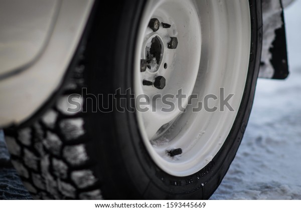 car
tire with winter tires in winter weather in
winter