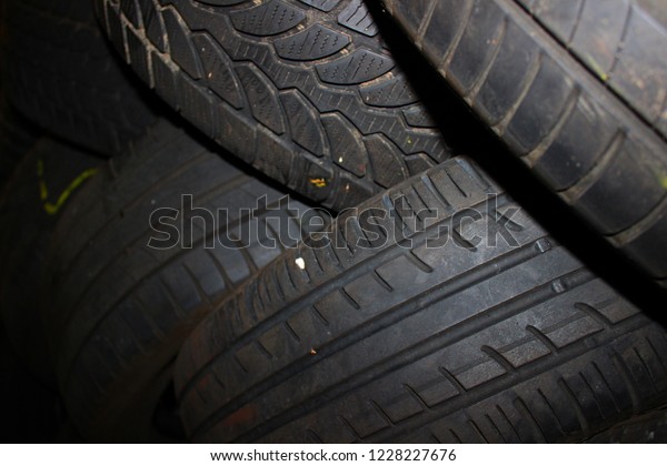 Car tires background. Tire wall. Rubber wheel.
Tire factory.