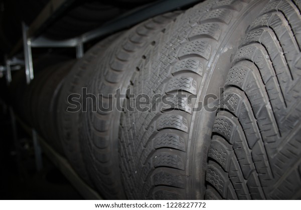 Car tires background. Tire wall. Rubber wheel.
Tire factory.