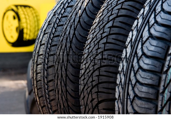 car tires displayed for sale, depicted in an\
abstract fashion