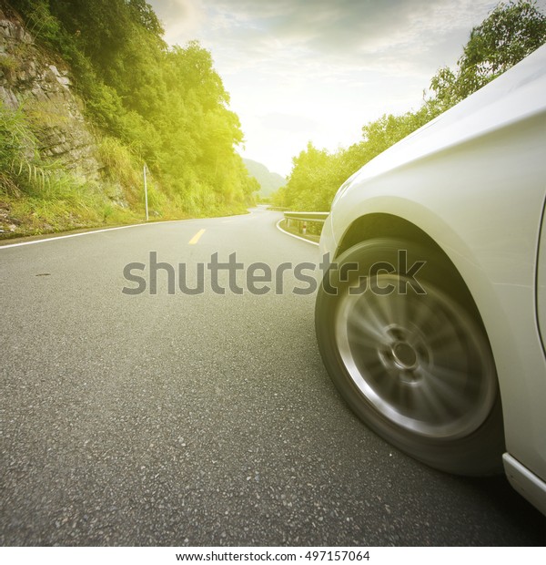 Car tires driving in the\
highway